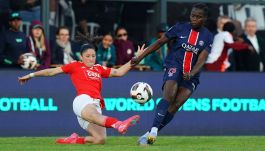 Griedge Mbock Bathy Nka of Paris Saint Germain is challenged by Lara Martins